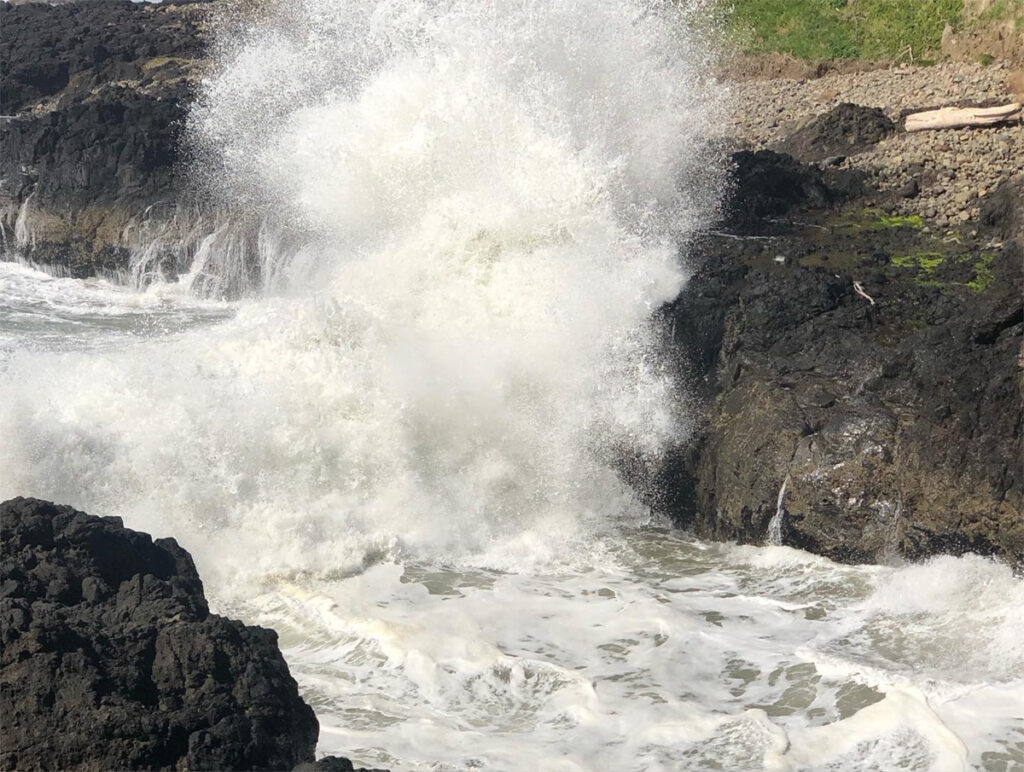 waves crashing against the rocky shore along the Pacific Northwest concept for article on negative-self-talk