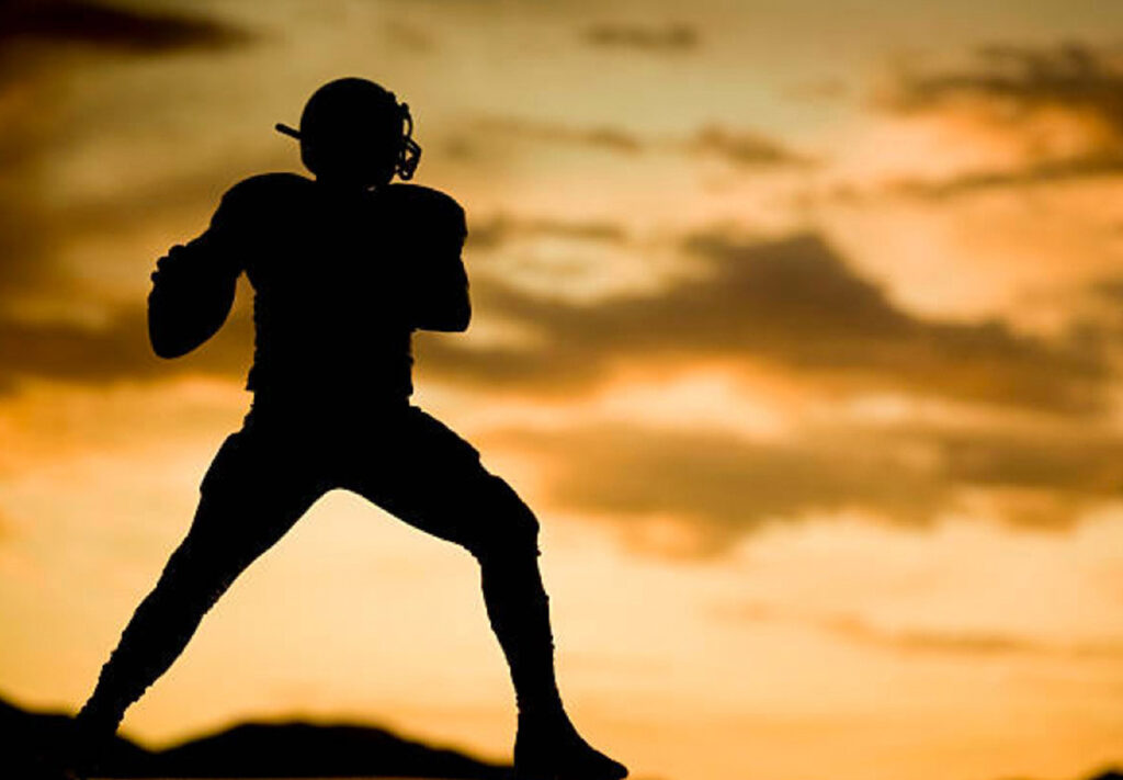 silhouette football quarterback connecting with spirit guides concept